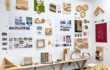 Exhibition wall of models and plans by Architecture students