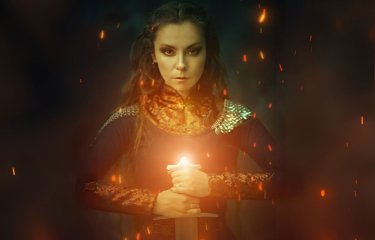 A celtic women looking at the camera holding a glowing sword
