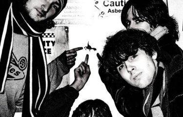 a black and white image of the band Morning, Cat