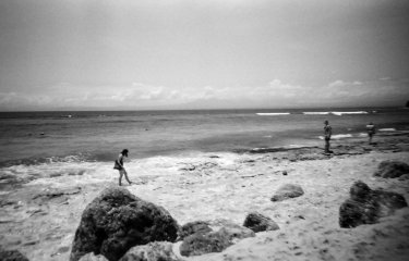 A black and white image of a beach