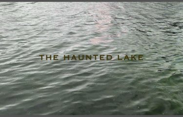An image of rippling water with the text "The Haunted Lake" across the centre