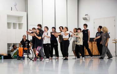 A group of young dancers in a line posing