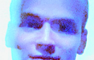 A blurred headshot of Toby Alford