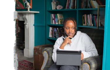 Digital marketing student working on laptop