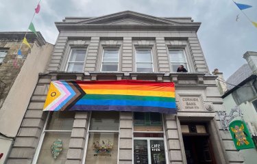 The Cornish Bank exterior building with pride flag