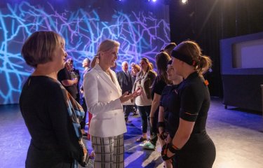 The Duchess of Edinburgh talking to two Games Academy students in a studio