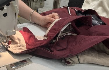 A student using a sewing machine