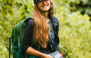 Hedvika Michnova on a location shoot carrying a camera 