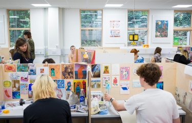 Students working in illustration studios at Falmouth University