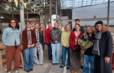 A group of Interior Architecture students and lecturer in a building interior