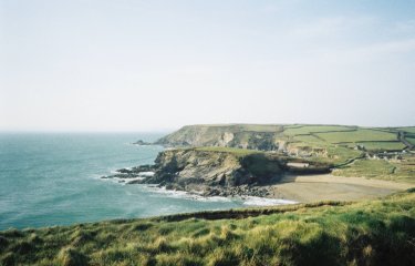 Landscape shot of the Cornish coast - the ocean and cliffs are visible
