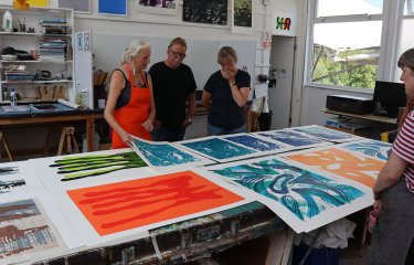 People looking at large scale screenprints