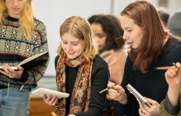 Students painting in a workshop at Falmouth Illustration Festival 