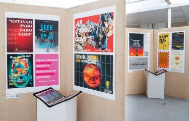 Advertising students work displayed on wall