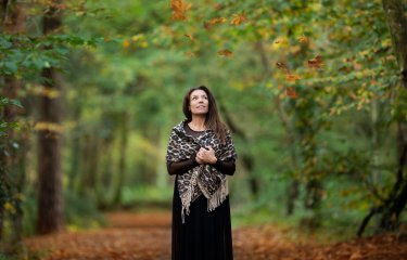 A woman stood in a forest