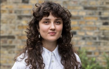 A woman smiling into the camera