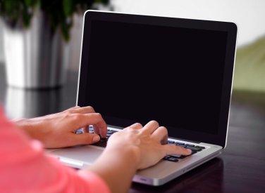 Person typing on a laptop