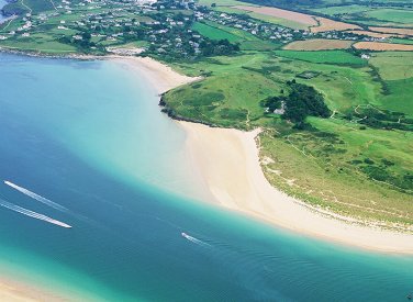 Aerial view of an estuary with sandy beaches and fields