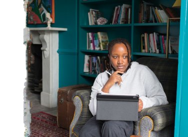 Digital marketing student working on laptop