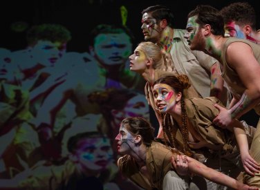 A group of acting students on stage