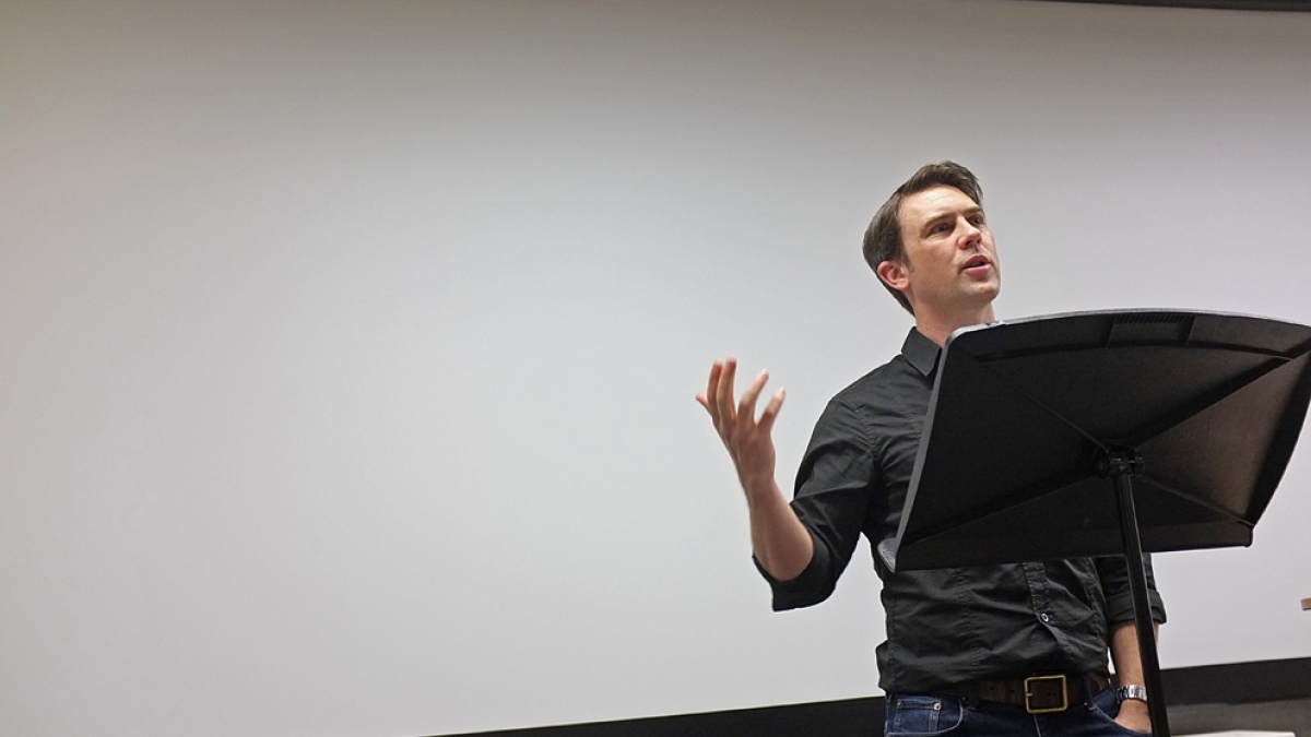 Poet and playwright Owen Sheers giving a lecture.