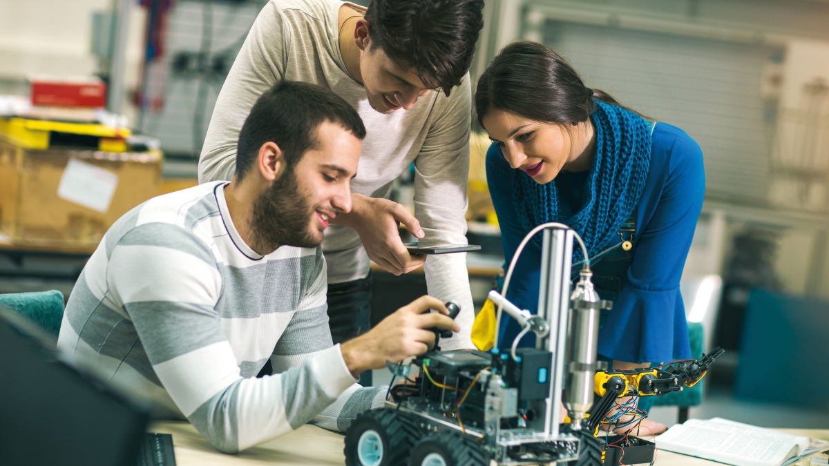Students controlling a robotic car with a smart phone.