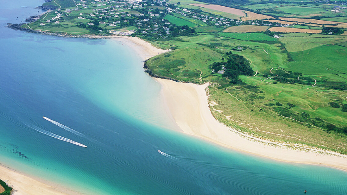 Aerial view of an estuary with sandy beaches and fields