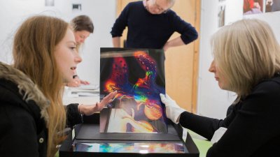 Falmouth Photography student and lecturer discussing work.