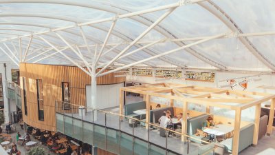 Students working at the Atrium on Falmouth University campus.