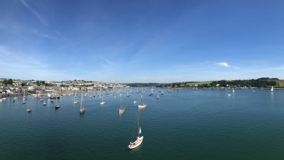 View of Falmouth from the water, coastline and boats.