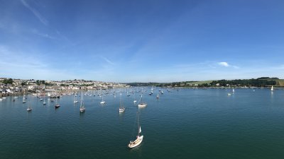 View of Falmouth from the water, coastline and boats.