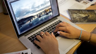 Student studying at laptop and desk