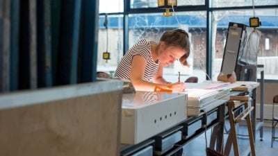 Female student working in textiles studio