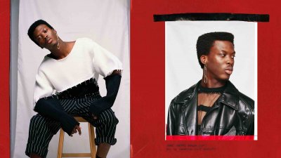 Model in two tone jumper and black leather jacket on red background.