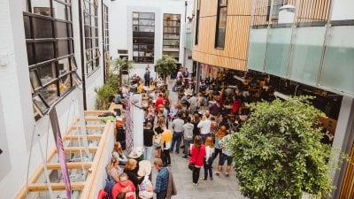 A crowd of parents and students at an Open Day inside Falmouth University's campus cafe