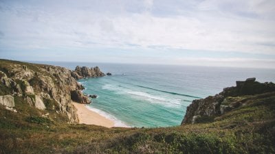 on a cliff top overlooking the beach and sea