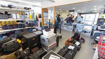 Falmouth's School of Film & Television storeroom room full of equipment in cases and bags.