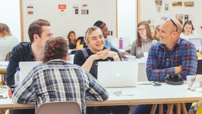 Students and a teacher in a graphic design studio