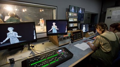 Audio visual studio showing live performance in foreground 