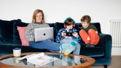 A family sat on a sofa