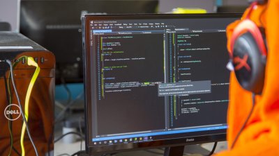 Student coding at computer