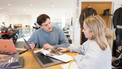 Student sitting in work placement at BMW garage