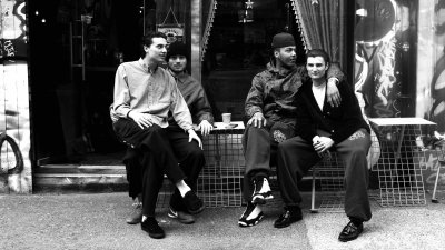 Four people sitting outside a cafe on Brick Lane photo by Alice McDonald