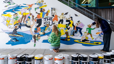 Students painting the Students' Union mural