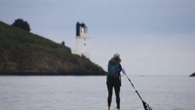 student paddleboarding