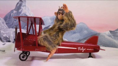 Model of a monkey on a red aeroplane