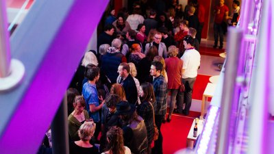 Crowd in foyer of AMATA arts centre