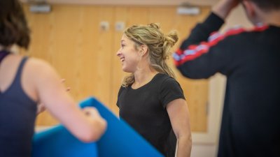 A small group of people looking away from the camera after completing a dance fitness class