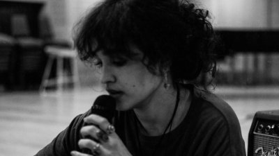 A black and white image of artist, Gaia Moura