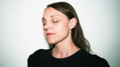 A headshot image of dance & choreographer Emily Alden